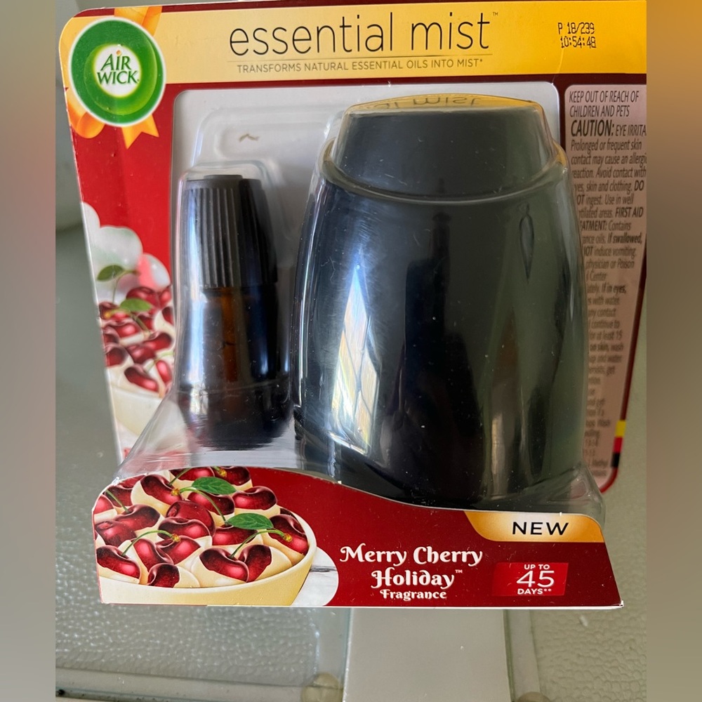 Air wick essential mist with refill.